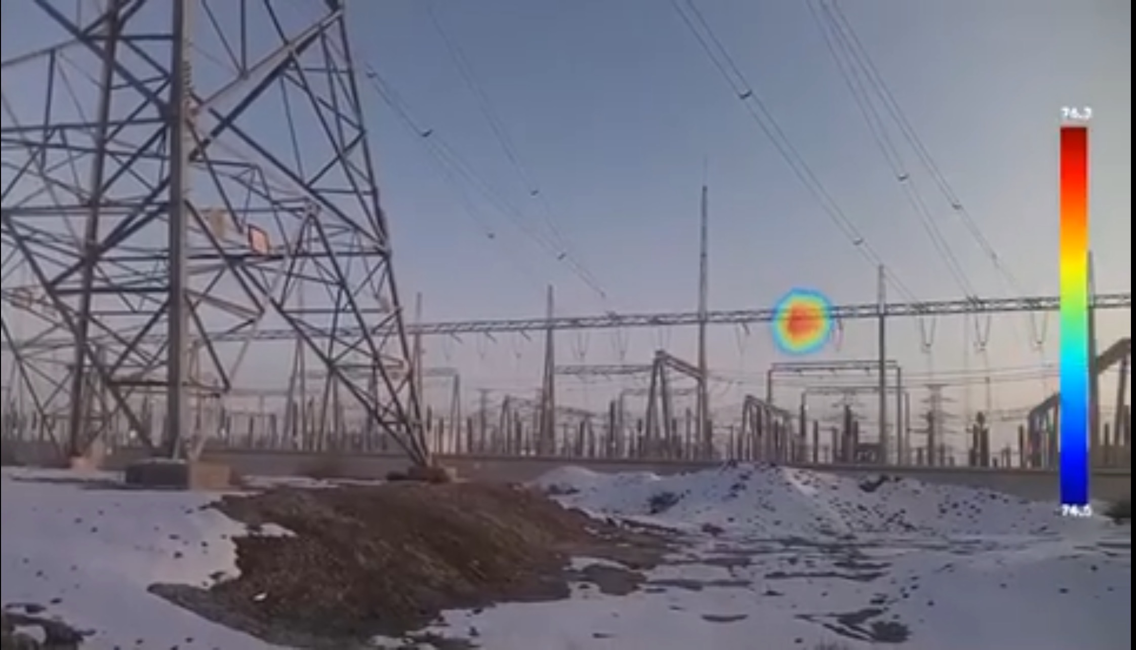 Original field-test image of an outdoor electrical installation with an acoustic source overlay